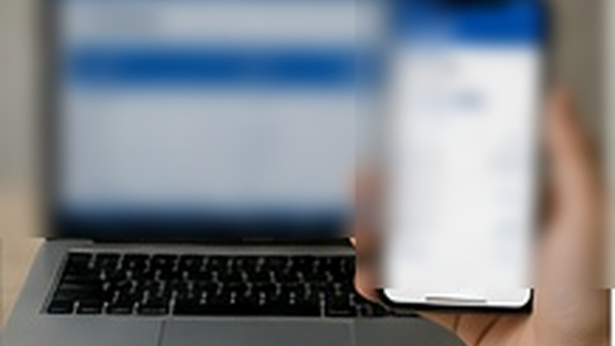 Laptop and smartphone representing comparison of international money transfer options