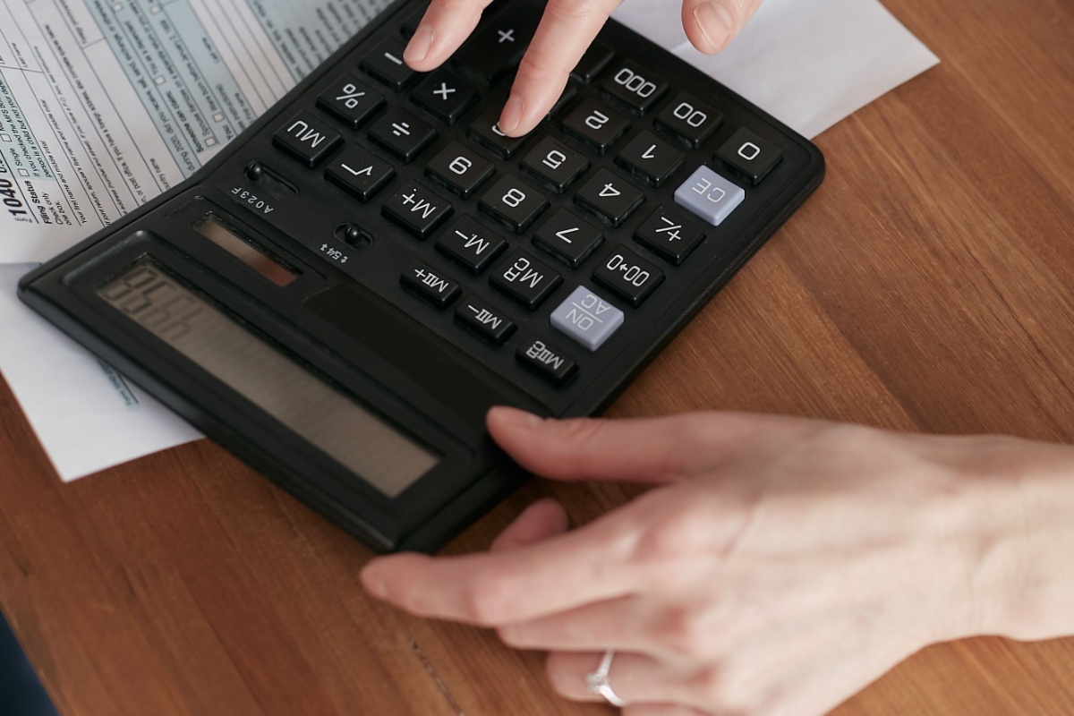 Calculator and paperwork used to check utility charges