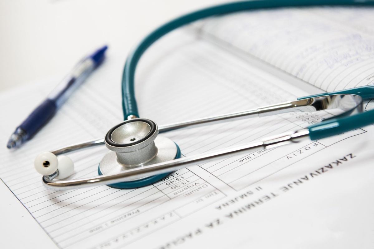 Stethoscope and medical form prepared for a clinic consultation