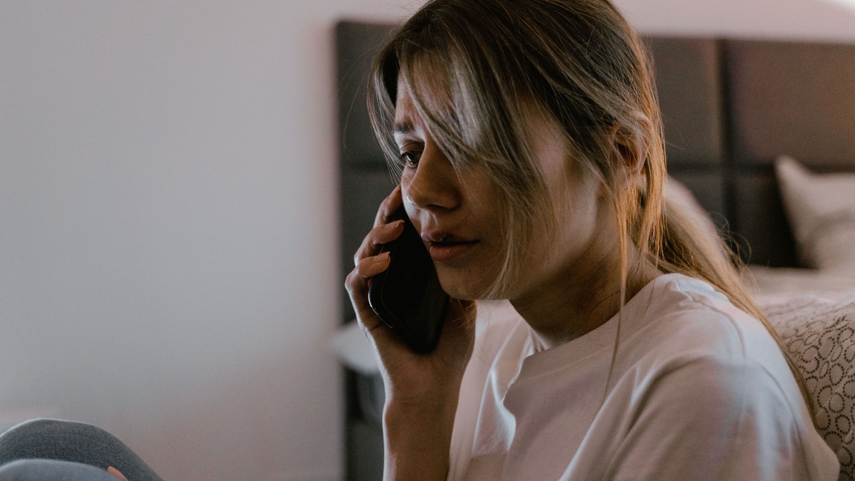 Foreign resident making an emergency phone call from a Japanese apartment