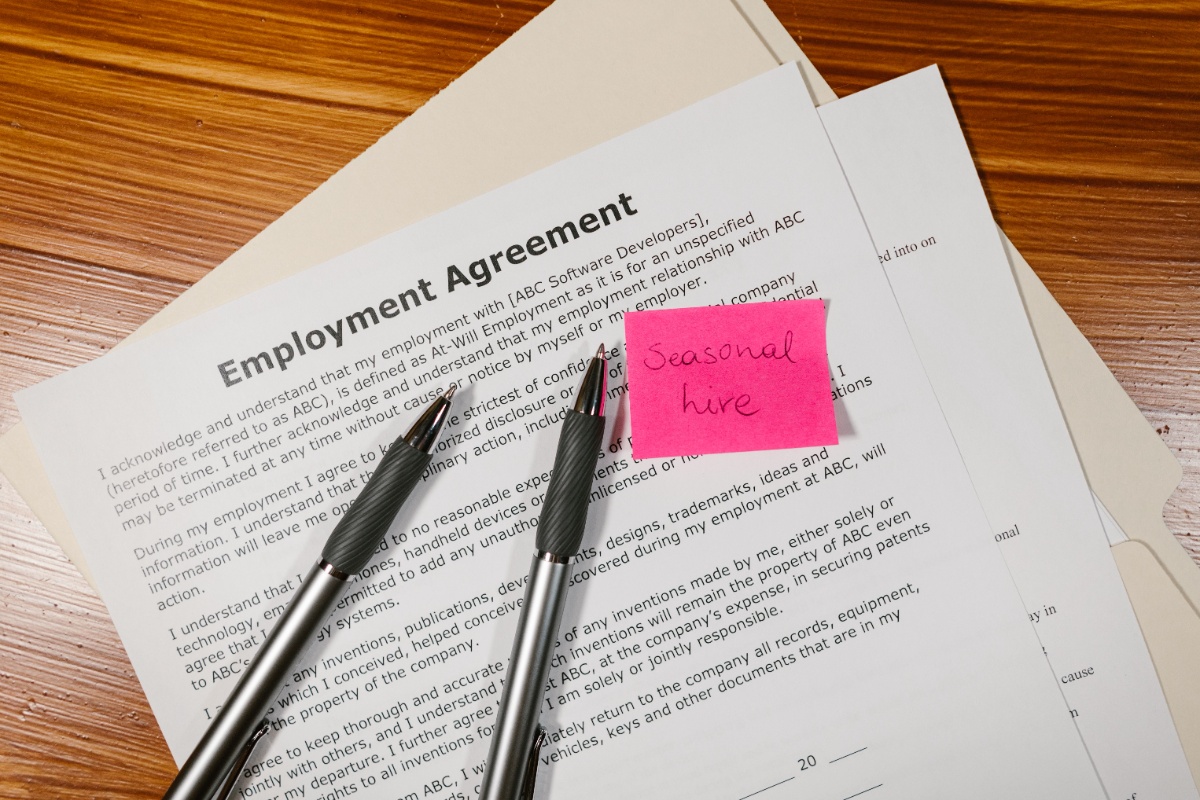 Employment agreement and pens on a desk