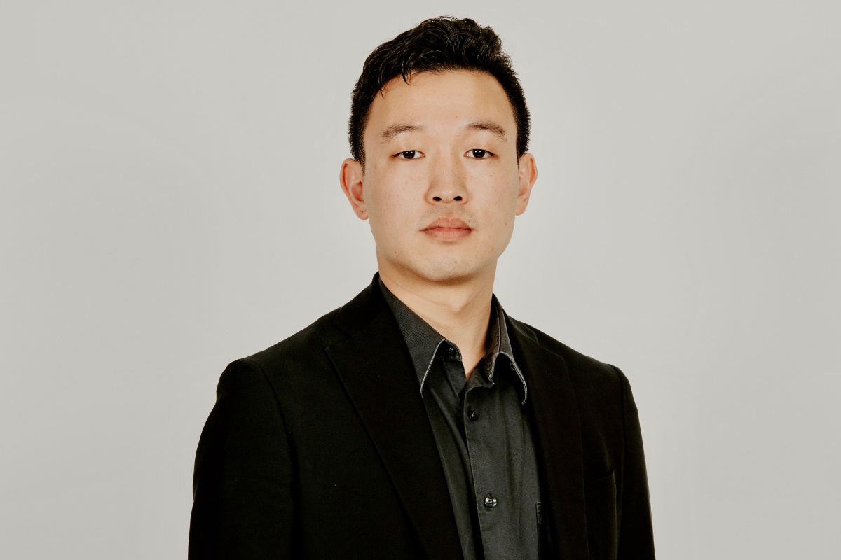 Professional headshot against a neutral background