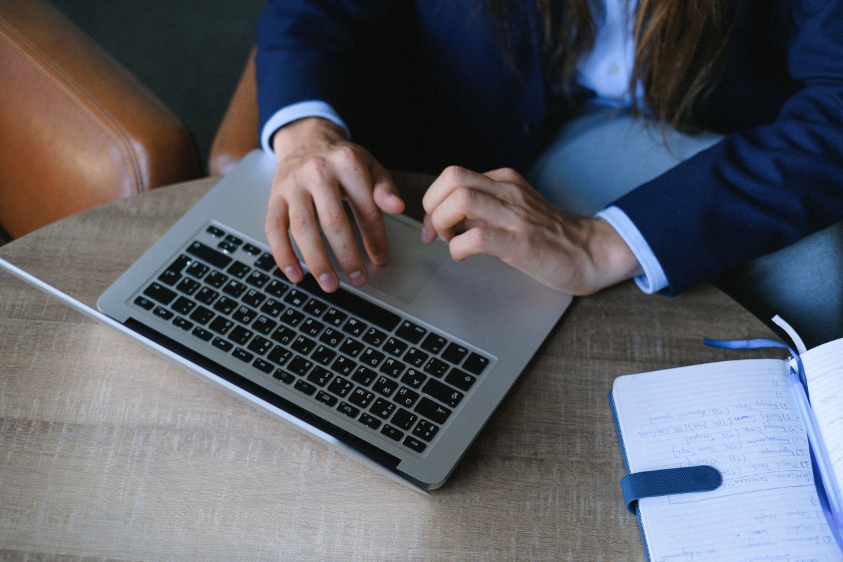 Laptop and notebook used to prepare evidence-based interview answers