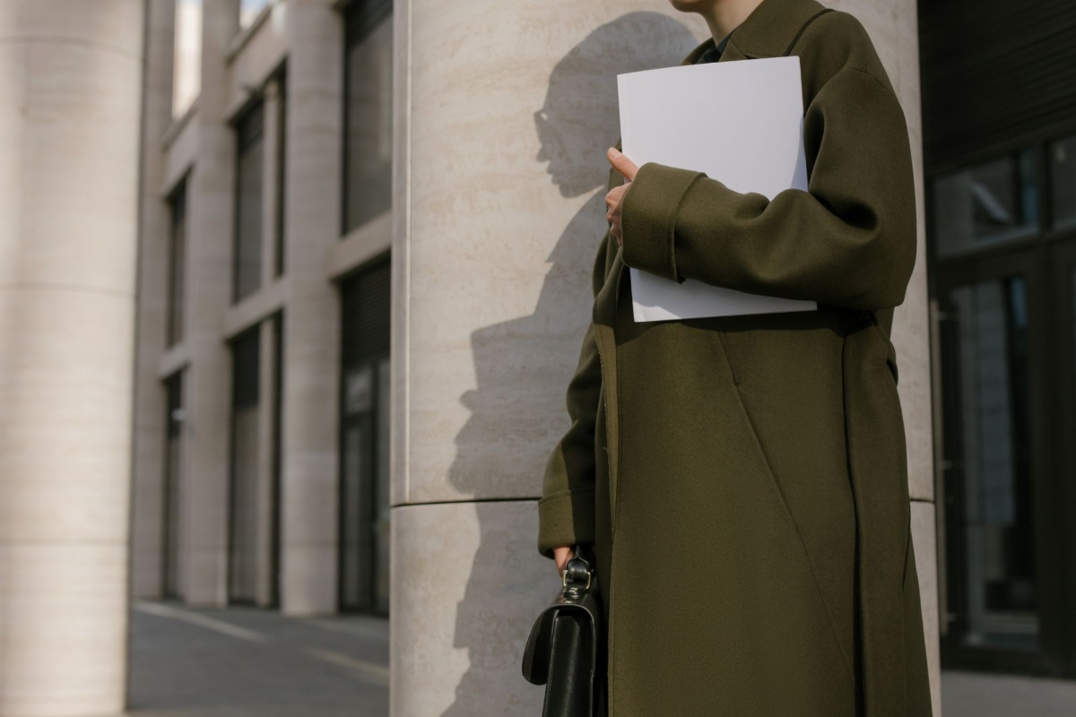 Resident leaving an office building with immigration documents