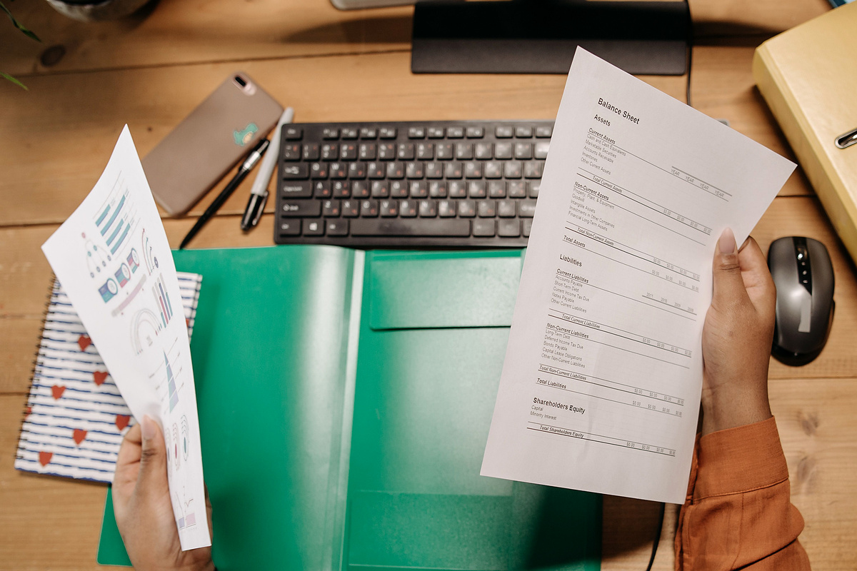 Person reviewing financial records used to understand a tax calculation