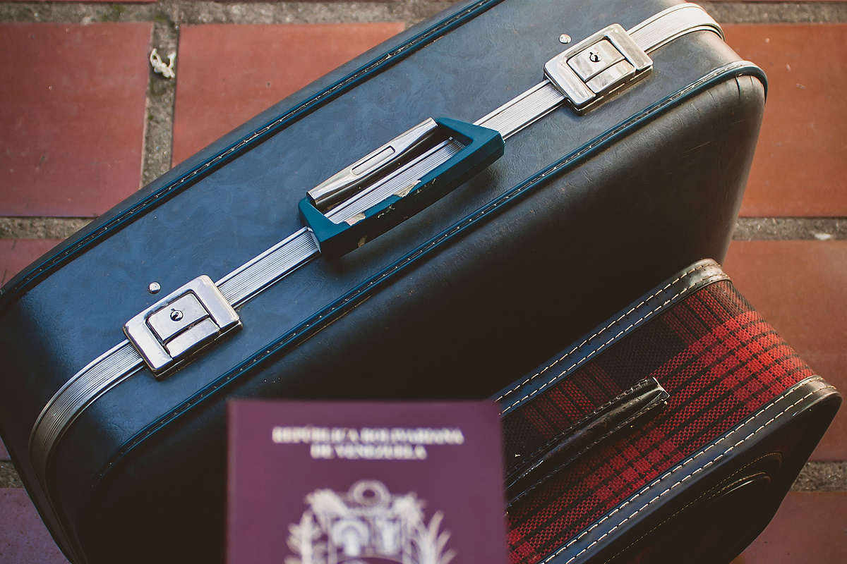 Suitcase and passport representing tax preparation before leaving Japan