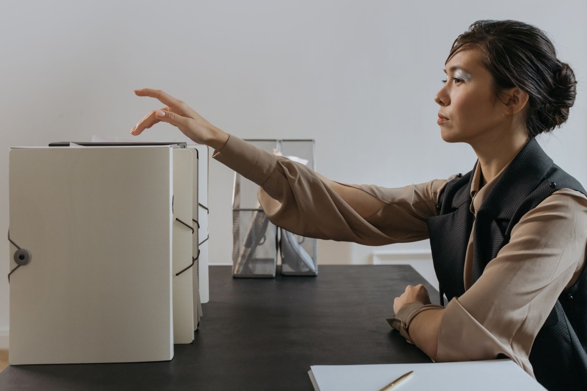 Worker organizing health insurance documents after a change of employment