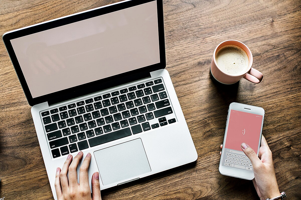 Laptop and smartphone used to check municipal resident certificate services