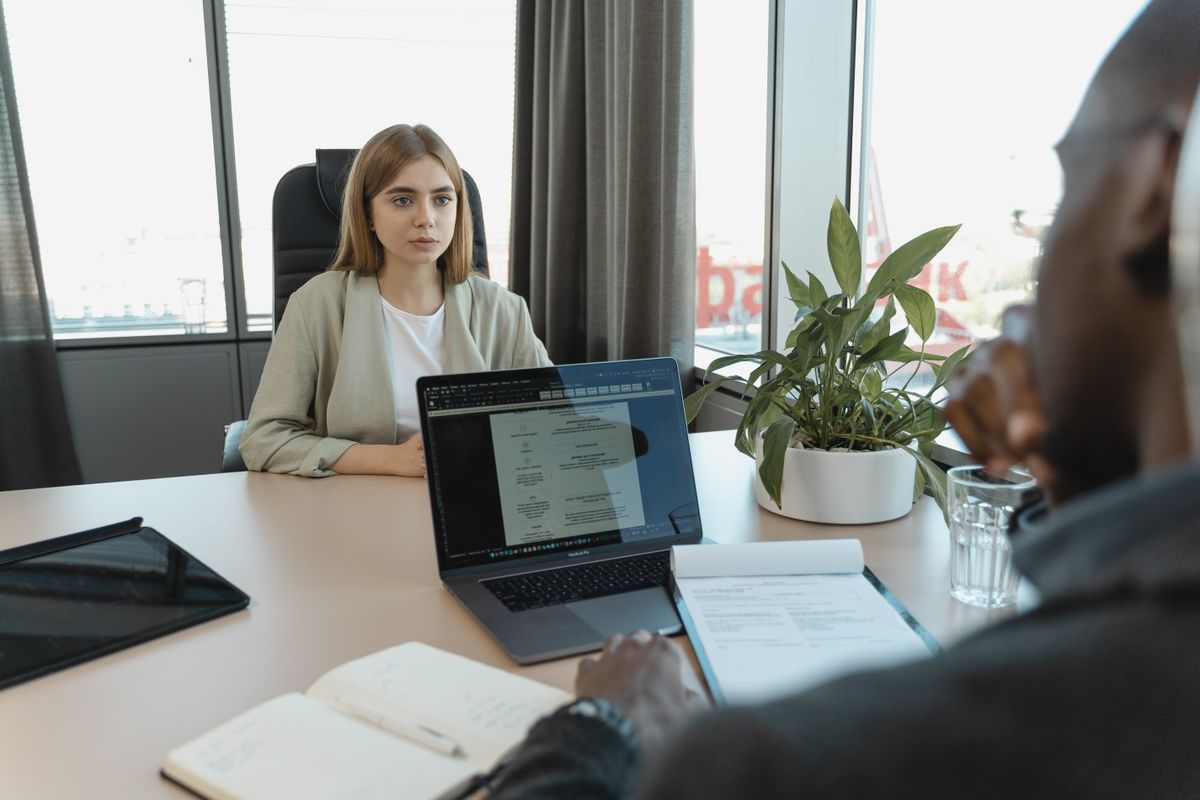 HR representative explaining employment terms to a new employee