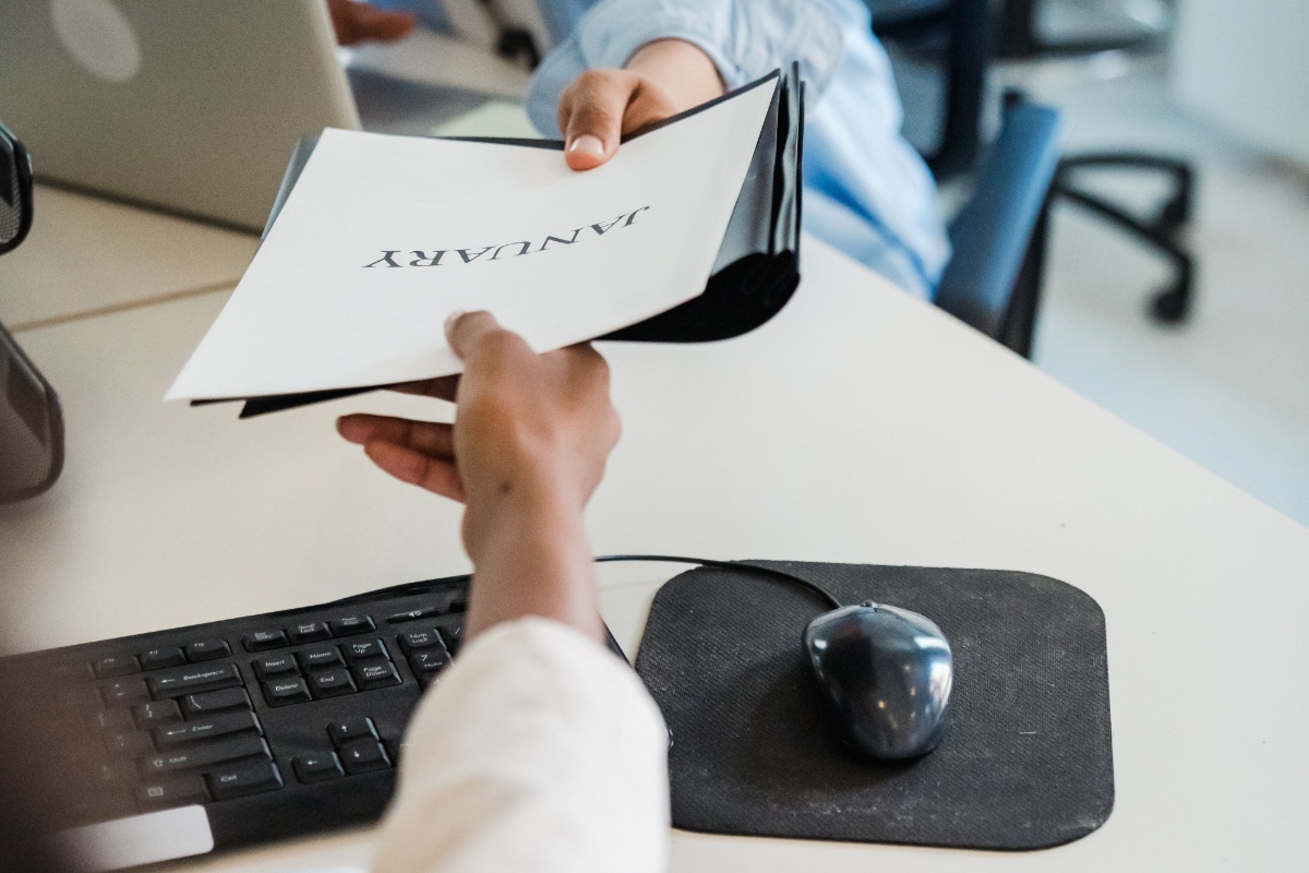 Employee reviewing payroll and employment documents before the first payday