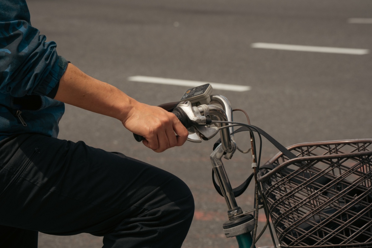 Close-up of bicycle handlebars and front equipment in Tokyo