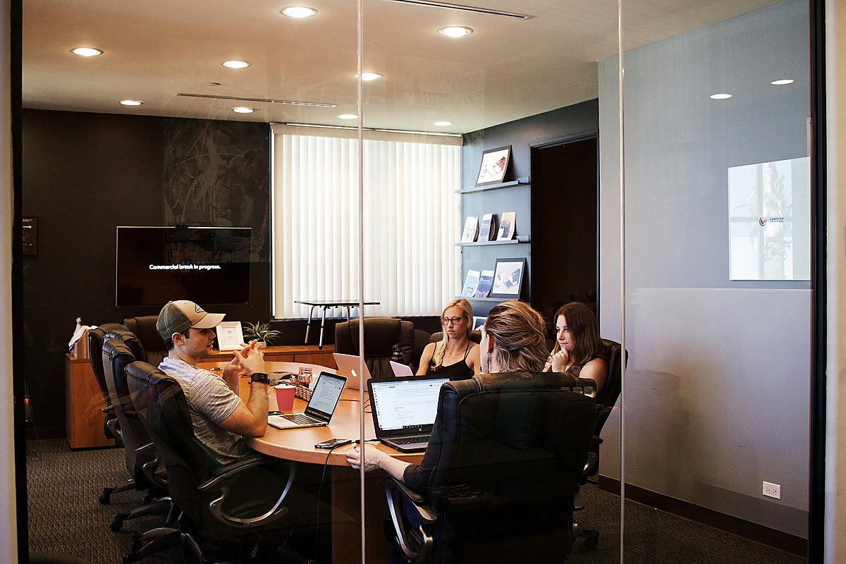 Workplace team discussing earthquake emergency procedures