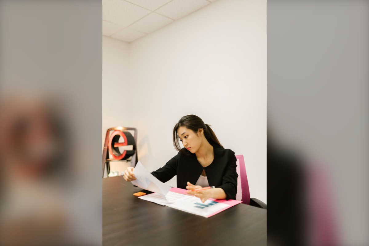Japanese office worker reviewing documents