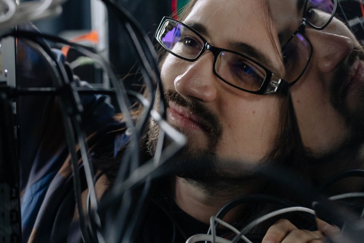 Technician working with network cables during internet installation