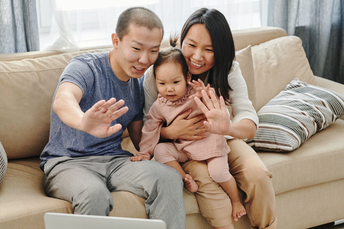 Family using a laptop for a video call at home