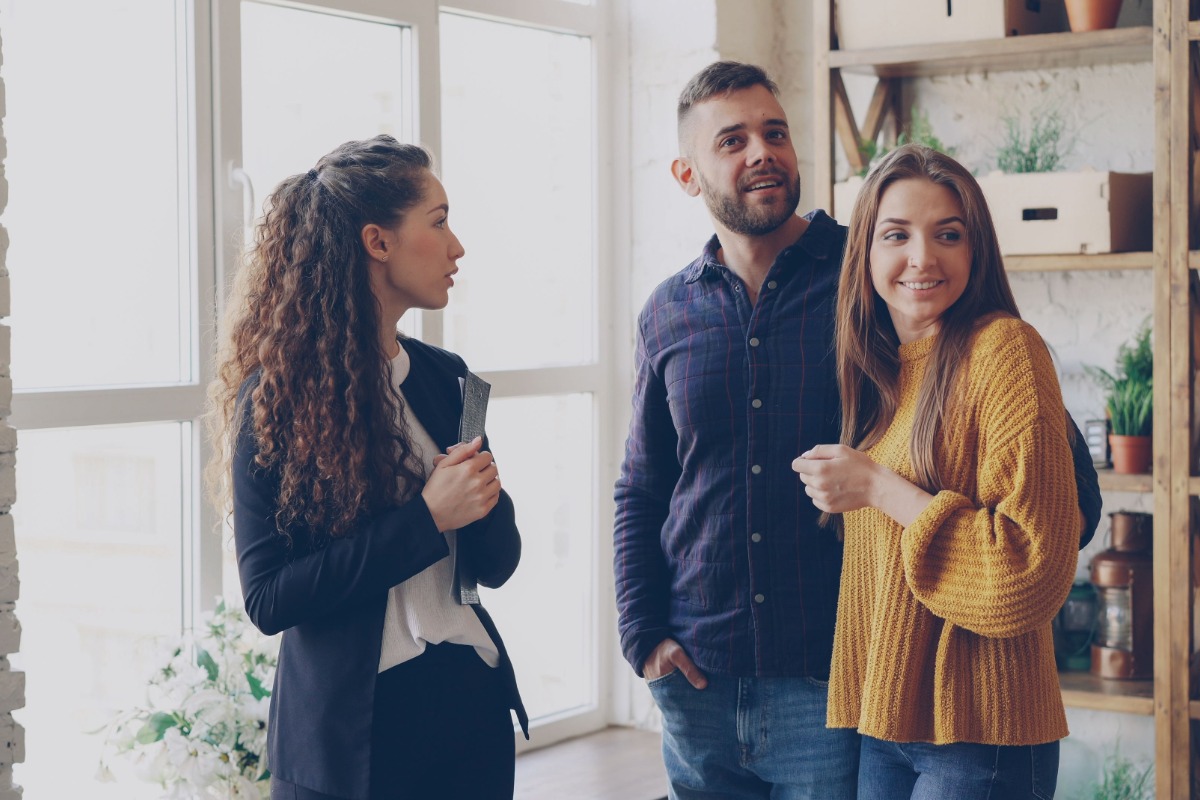 Real estate agent showing an apartment to prospective renters