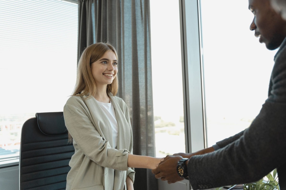 Candidate and interviewer shaking hands after a job interview
