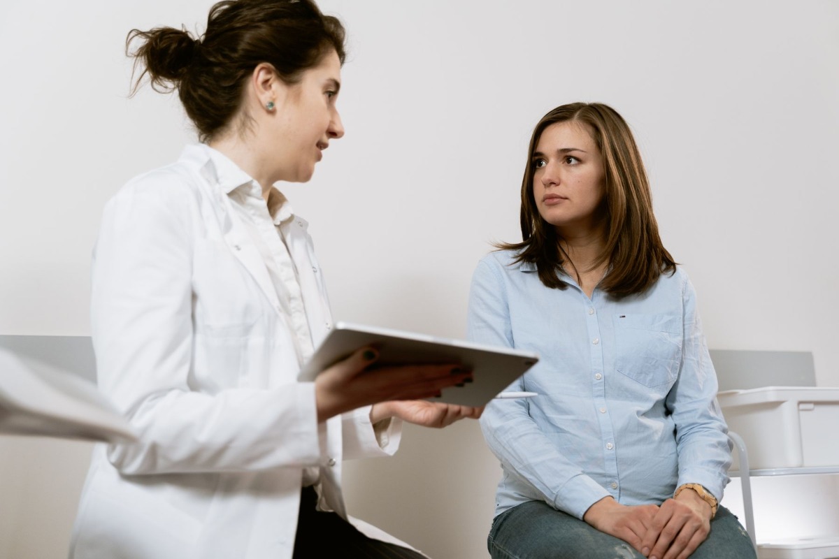 Patient and doctor meeting in person in a clinic