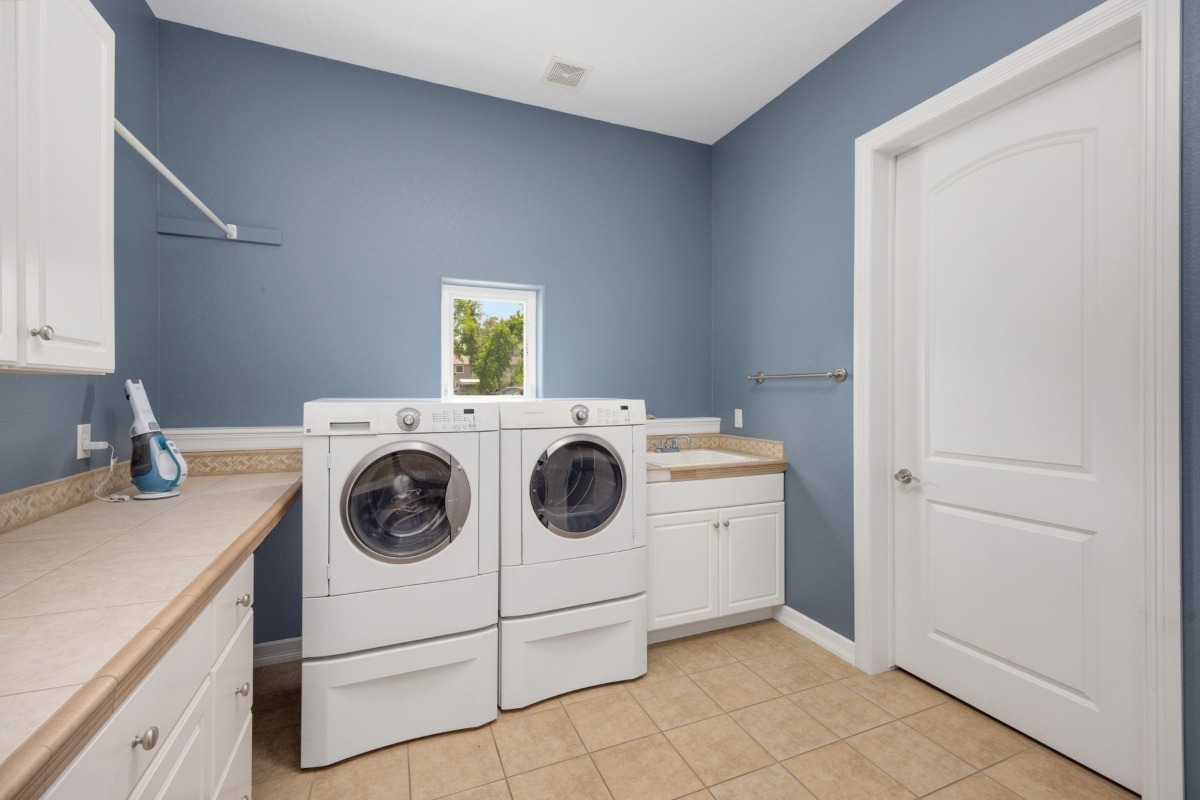 Modern washing machines installed in a home laundry area