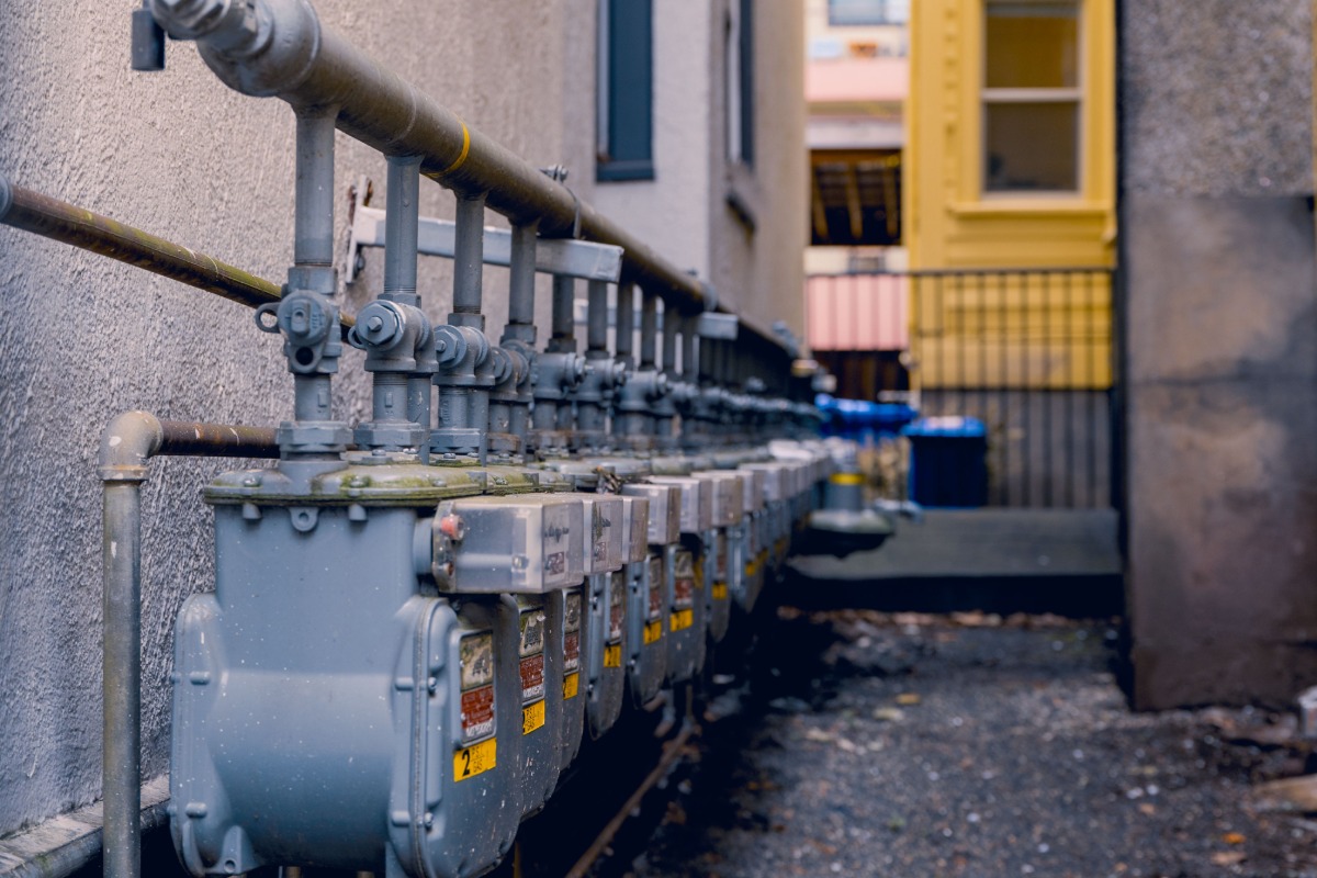 Gas meters installed along a residential building