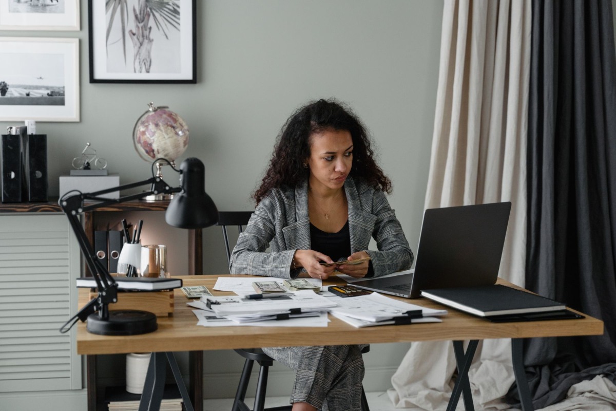 Office worker reviewing salary and deduction documents