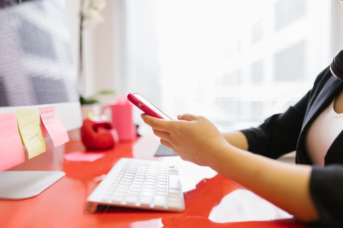 Professional checking take-home pay on a smartphone
