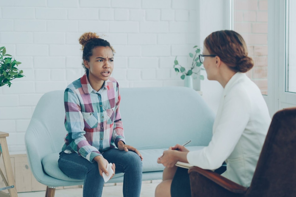 Therapist and client talking during a mental health consultation