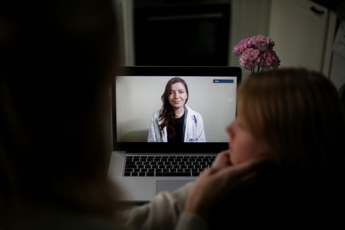 Patient having an online medical consultation by laptop