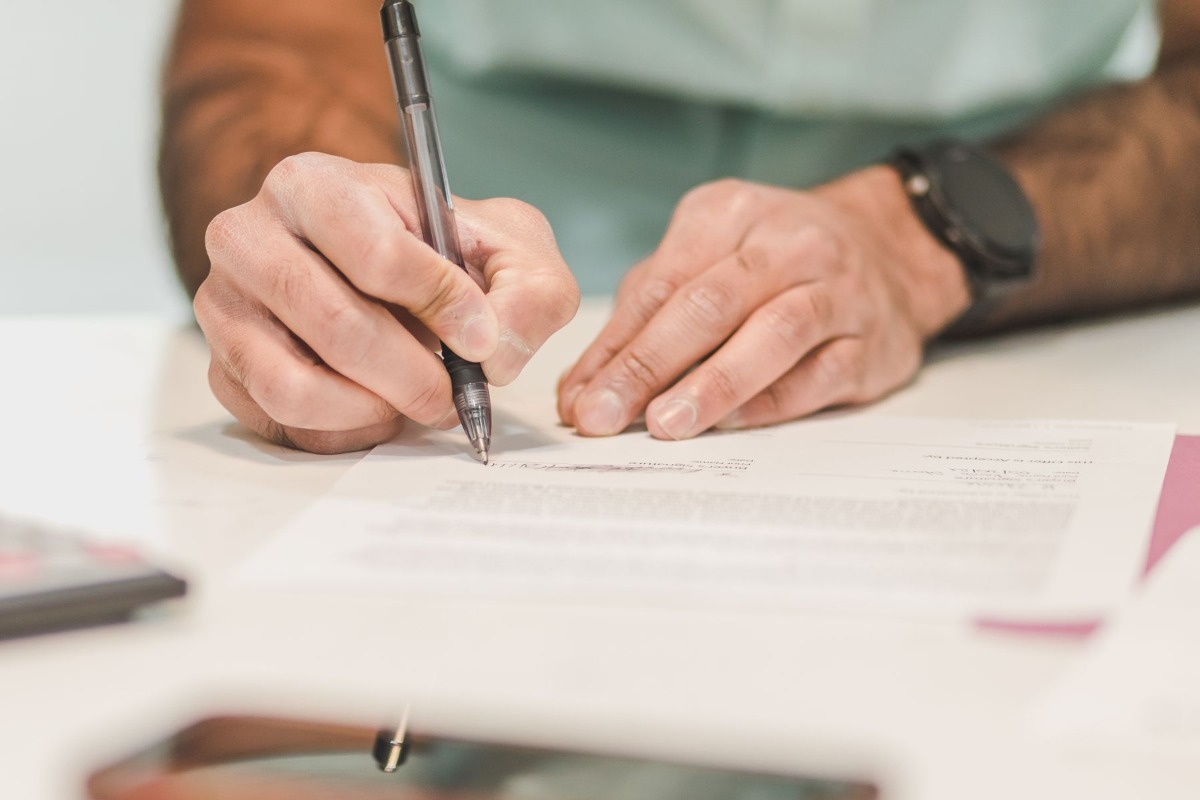Person signing an official document application