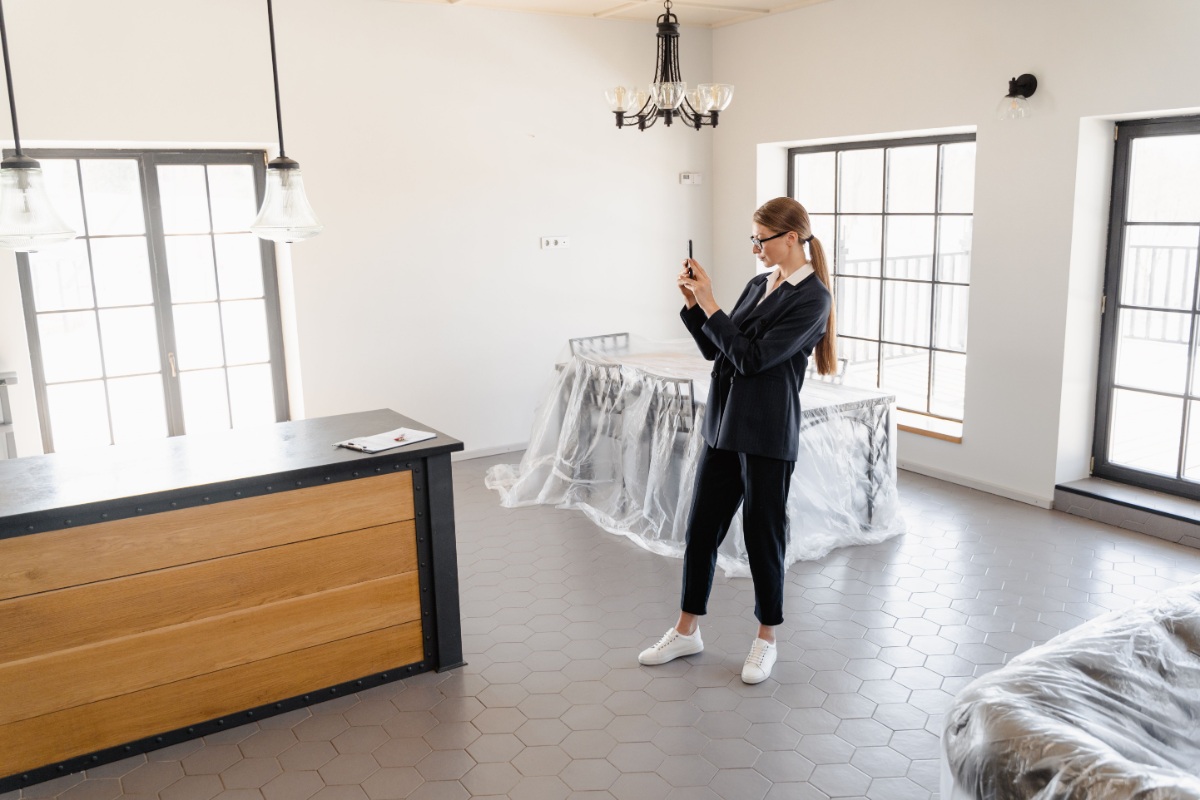 Real-estate professional documenting an apartment interior