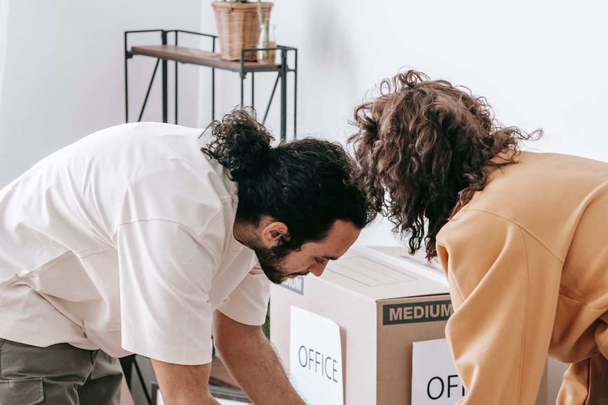 Tenants organizing paperwork and boxes before moving out