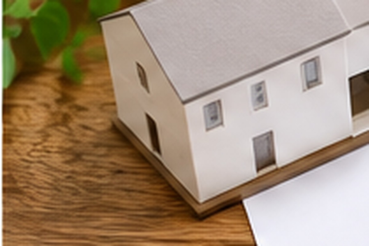 Small house model representing a decision about renewing a rental home