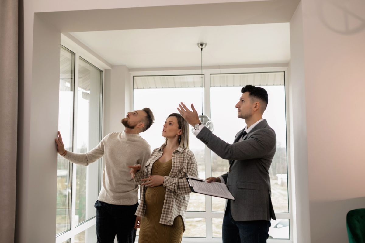 Renters inspecting an apartment with a property professional