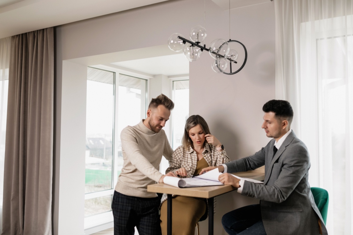 Renters reviewing housing documents and the final settlement