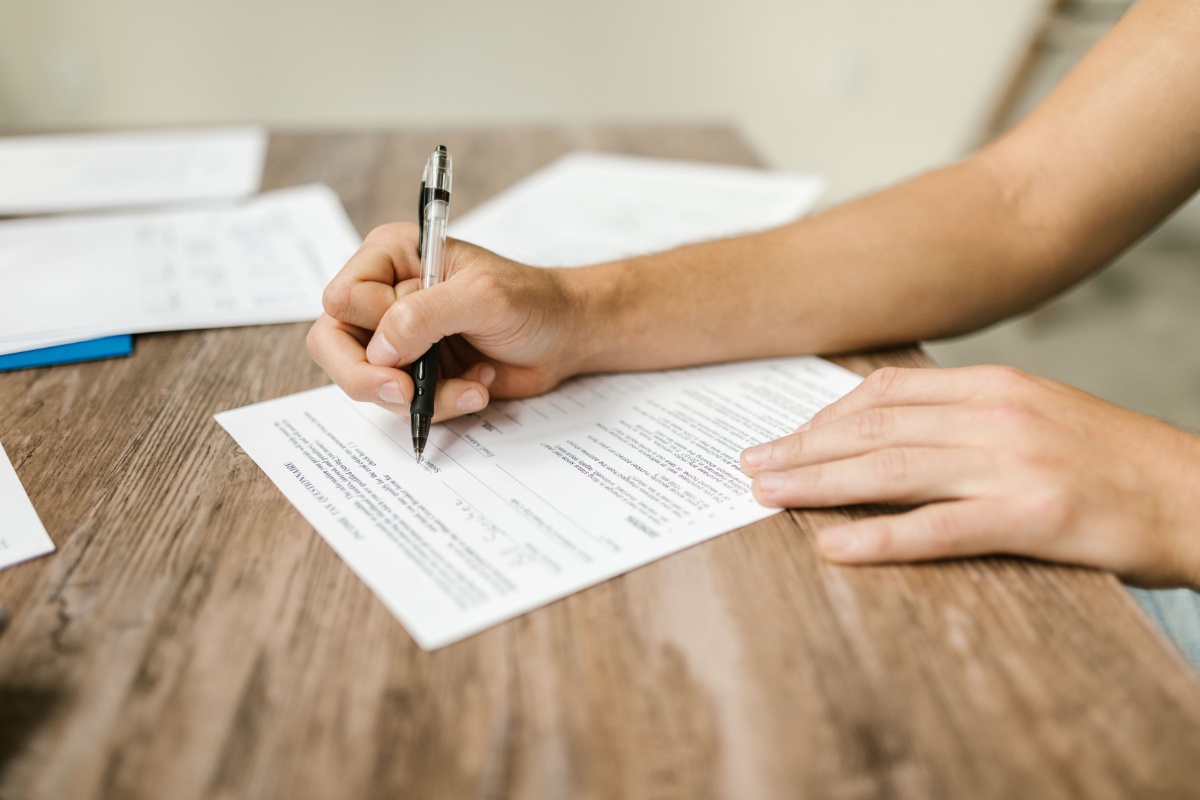 Person completing a My Number Card application form