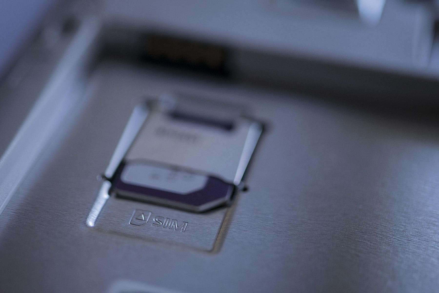 Close-up of a SIM card seated in a smartphone SIM tray